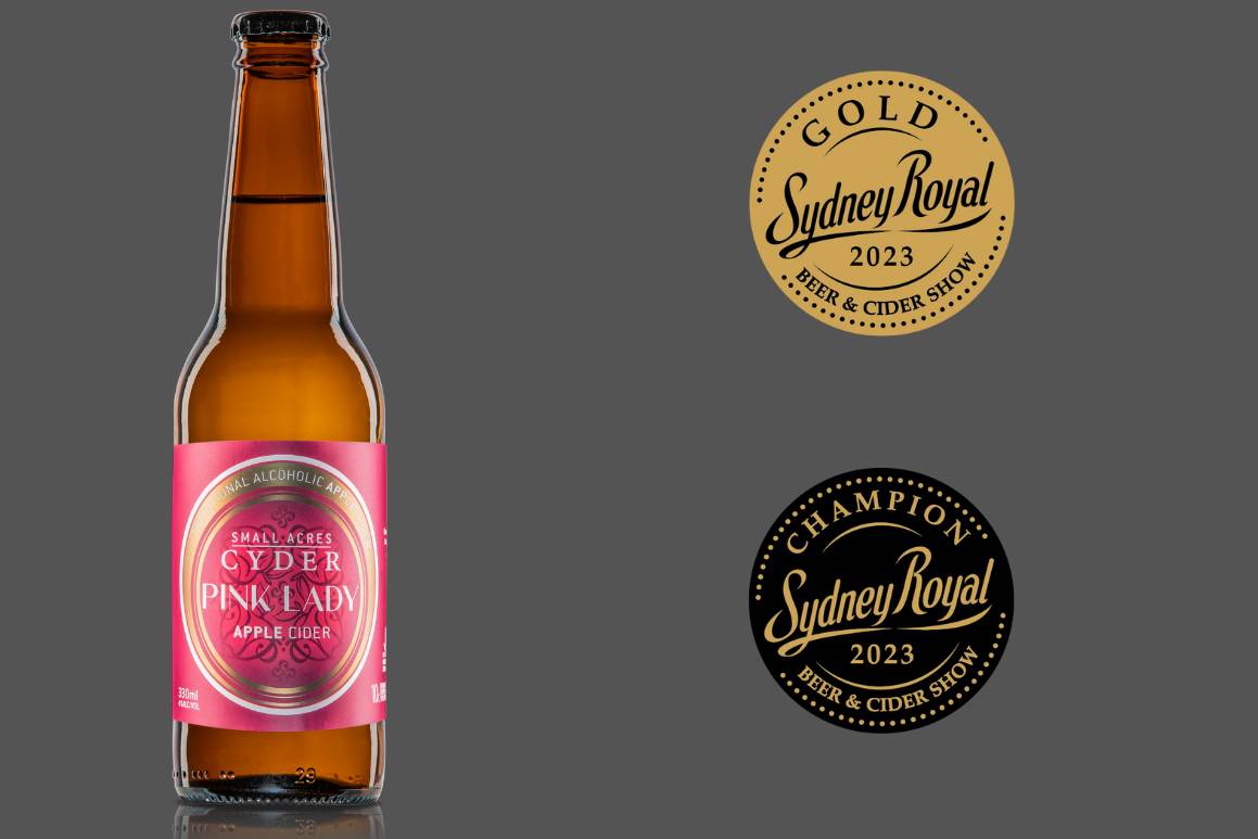 A 330ml bottle of Small Acres Cyder Pink Lady apple cider and Champion and Gold Medal images from Sydney Royal Beer and Cider Show 2023