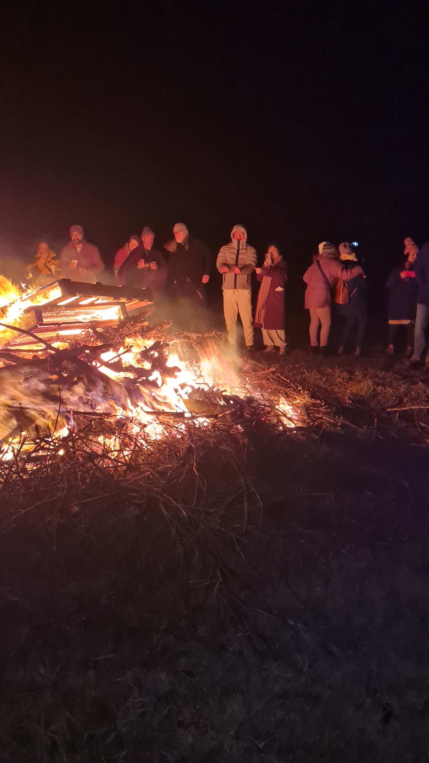 A group of people enjoying a bonfire