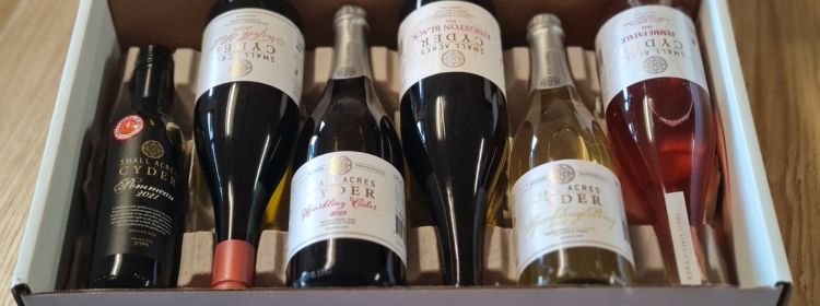 Bottles of cider lying in a flat box