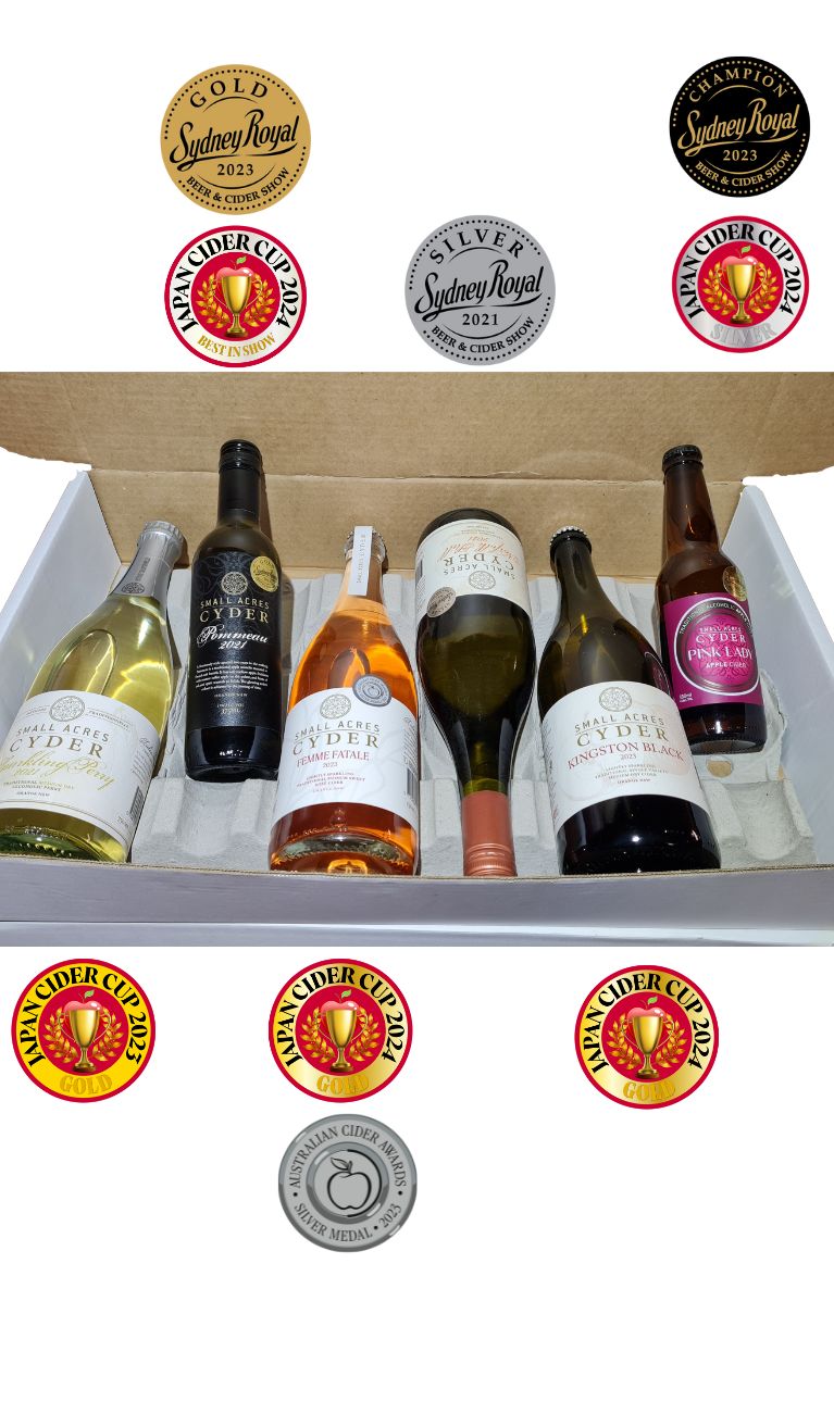 A case of ciders with a variety of medals from Japan Cider Cup and Cider Australia's Australian Cider Awards displaying
